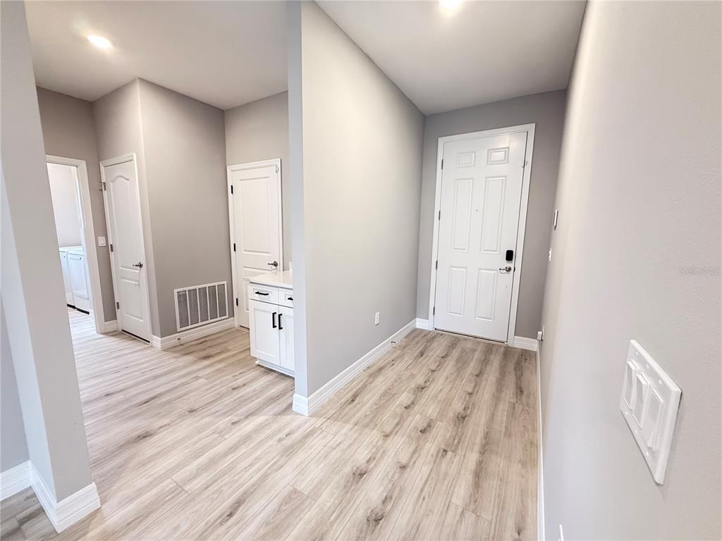 7815 Southwest 128th St Road Ocala, FL 34473 - Photo 31 of 40 a view of a hallway with wooden floor