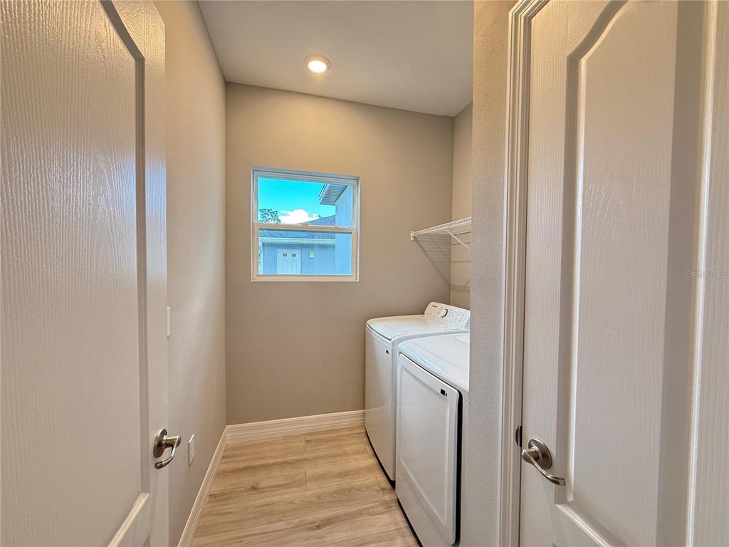 7815 Southwest 128th St Road Ocala, FL 34473 - Photo 33 of 40 a room with a washer and dryer