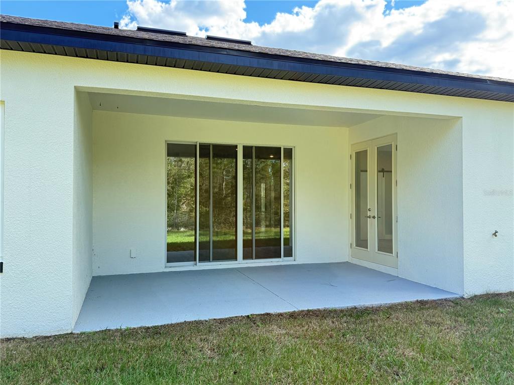 7815 Southwest 128th St Road Ocala, FL 34473 - Photo 35 of 40 a view of front door and yard