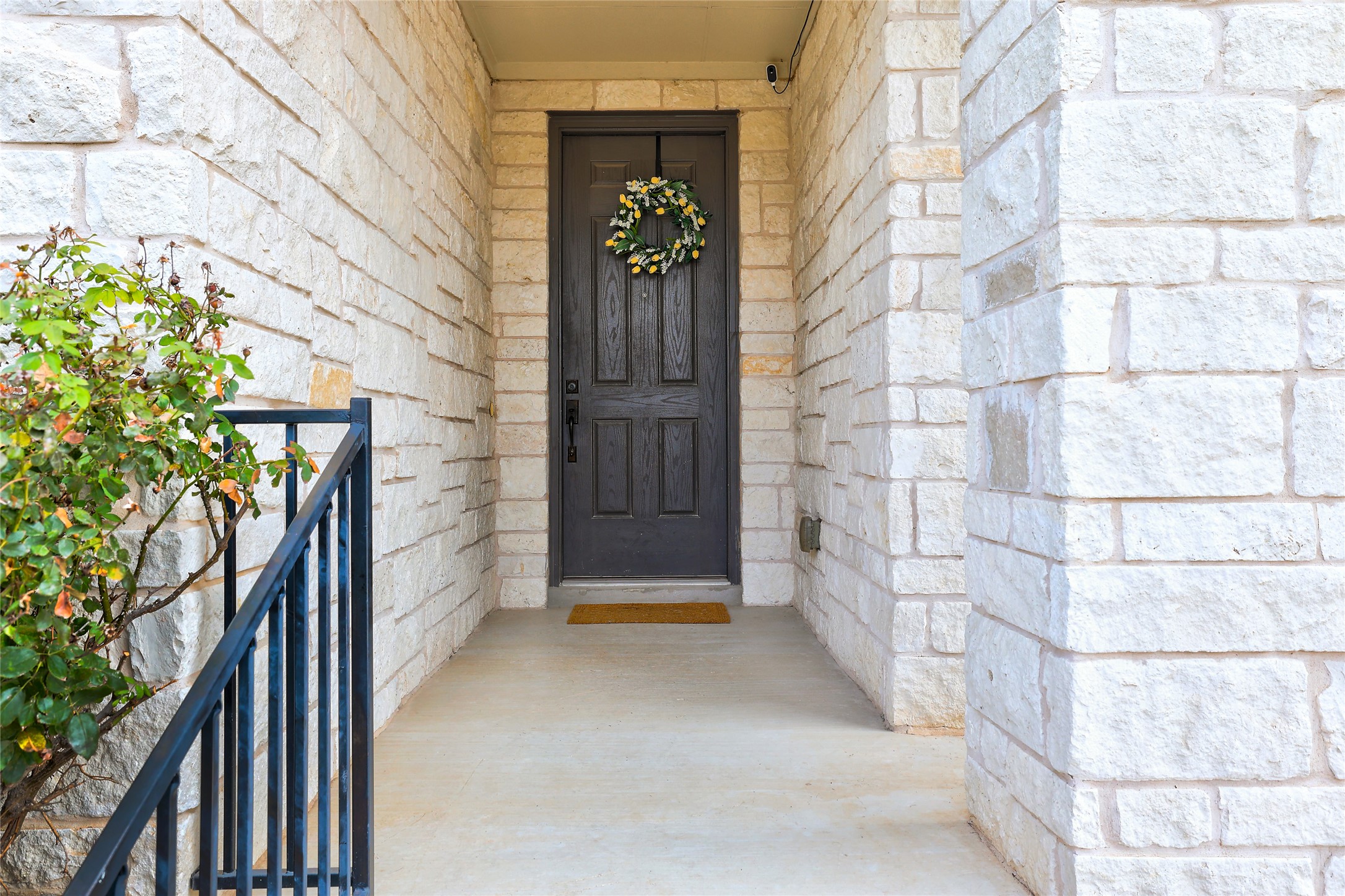 7501 Janes Ranch Road Austin, TX 78744 - Photo 2 of 19 Covered porch with a beautiful wood-stained door.