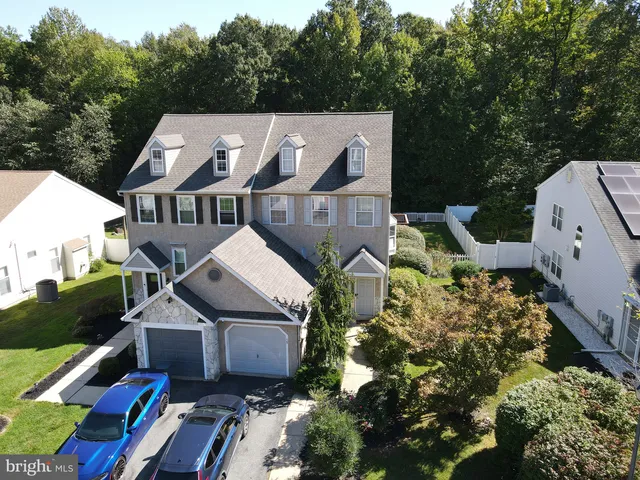 an aerial view of a house with a garden