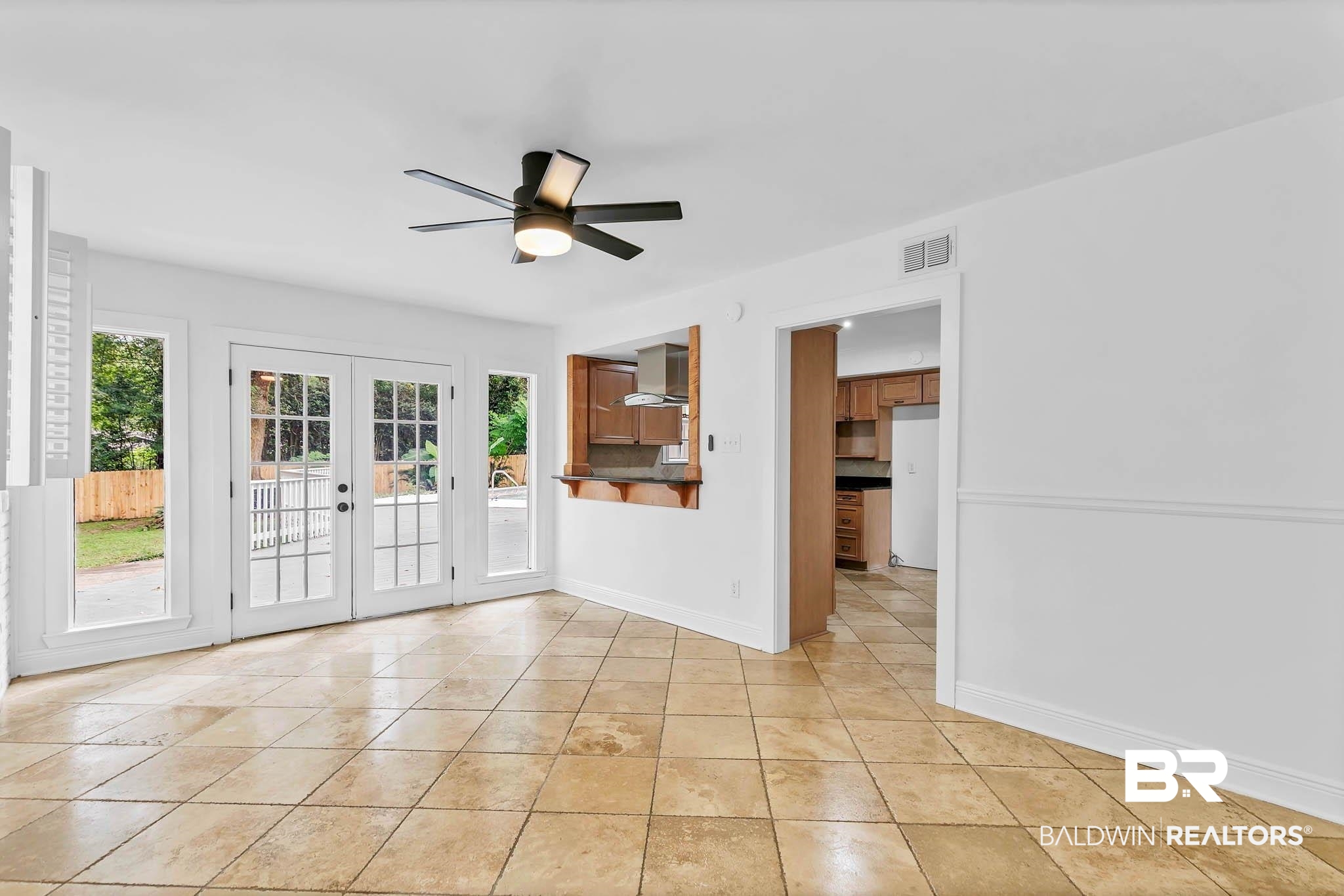 4705 Sherry Court Mobile, AL 36693 - Photo 15 of 100 Unfurnished living room with healthy amount of natural light, french doors, light tile patterned floors, and ceiling fan