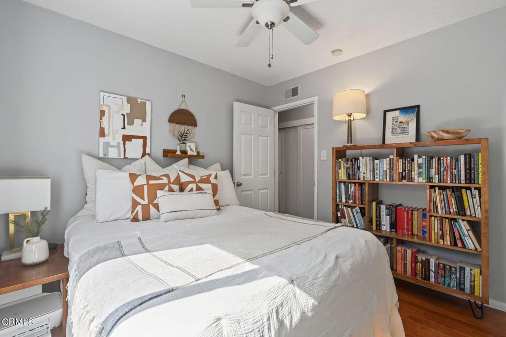 525 North M Street Oxnard, CA 93030 - Photo 20 of 38 a bedroom with a bed and a book shelf