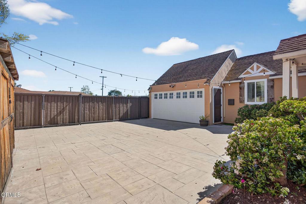 525 North M Street Oxnard, CA 93030 - Photo 37 of 38 a swimming pool with wooden fence