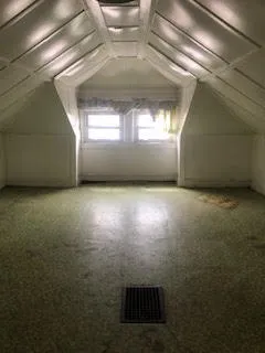 a view of a room with a window