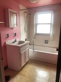 a bathroom with a sink a vanity and a mirror