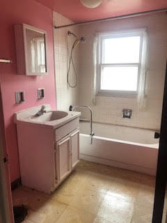3343 West 64th Place Chicago, IL 60629 - Photo 15 of 22 a bathroom with a sink a vanity and a mirror