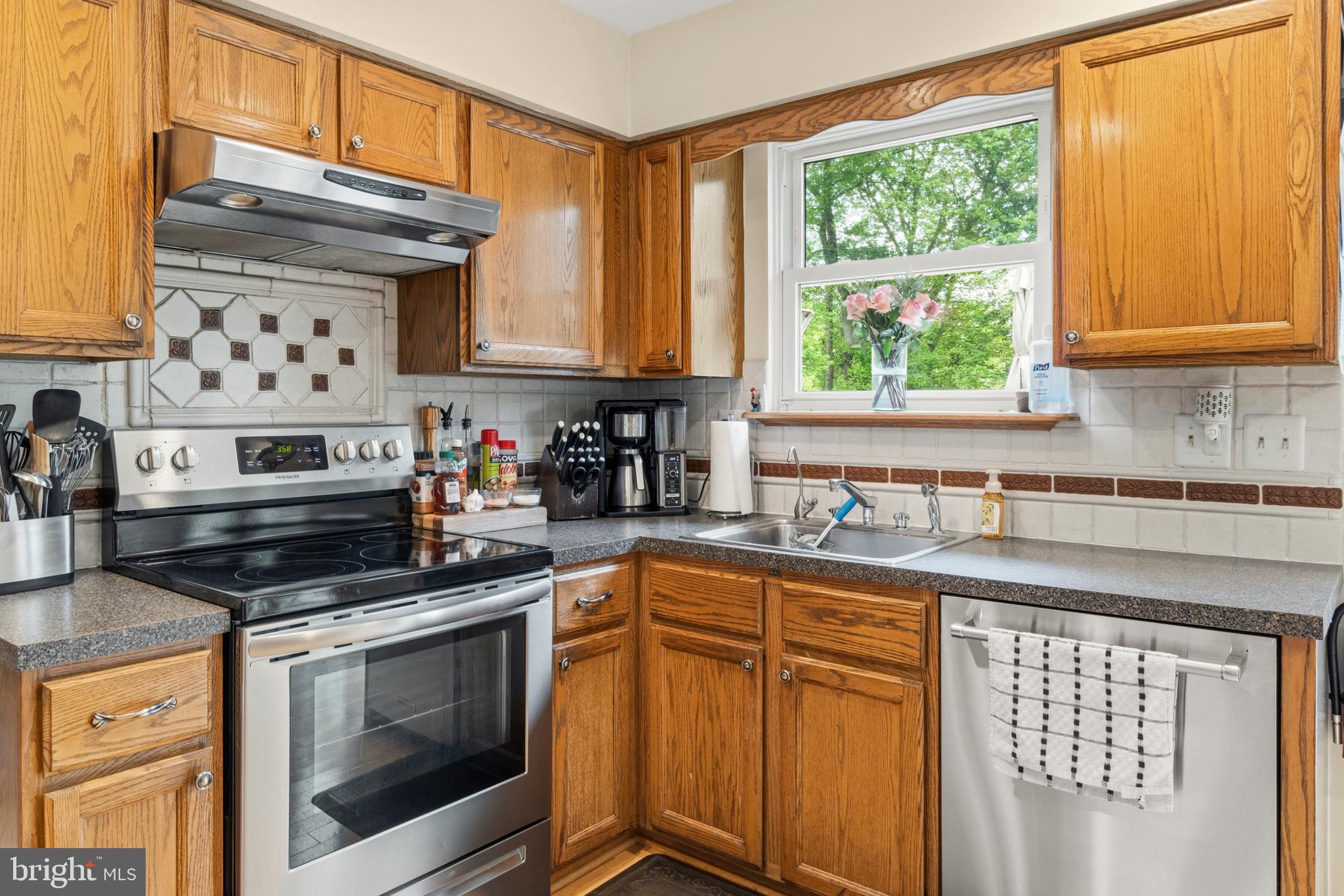 2 Farnham Court Laurel Springs, NJ 08021 - Photo 10 of 33 a kitchen with stainless steel appliances granite countertop a stove sink and cabinets