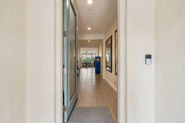 a kitchen with kitchen island granite countertop a sink counter and chairs