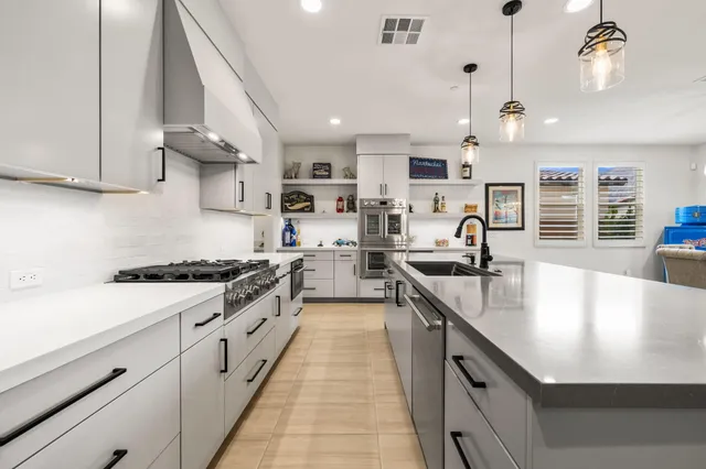 a view of a dining room with furniture wooden floor and chandelier