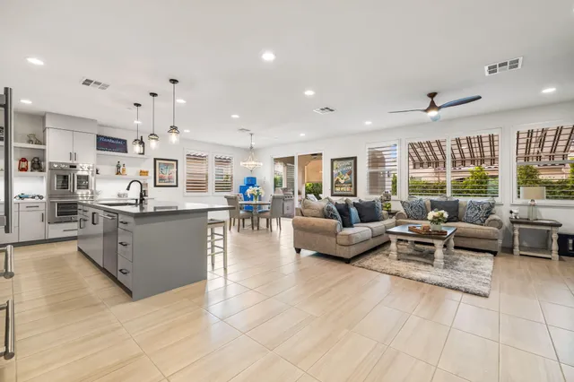 a spacious bathroom with a granite countertop sink mirror and bathtub