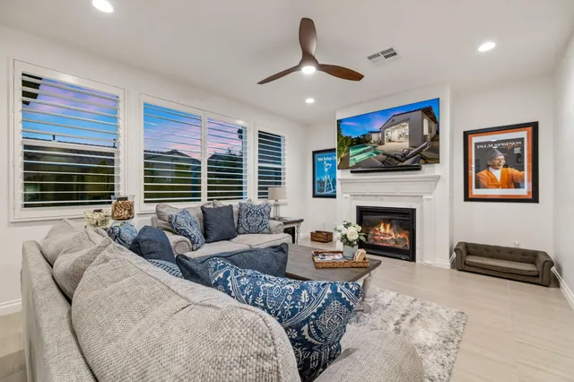 a spacious bathroom with a double vanity sink double mirror and a bathtub