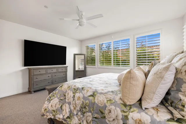 a bathroom with a sink a vanity and a window