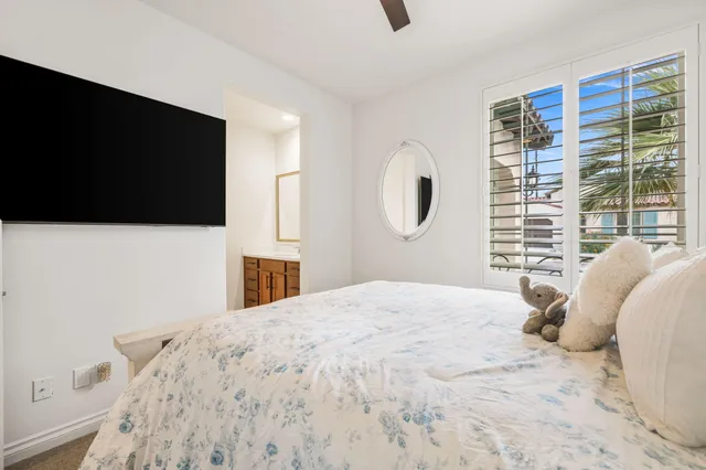 a view of a patio with couches table and chairs and potted plants