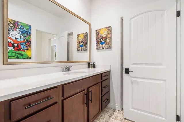 a view of a patio with couches chairs and potted plants with sky view