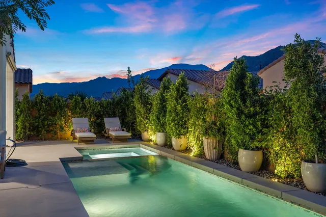 a view of a patio with chairs and tables