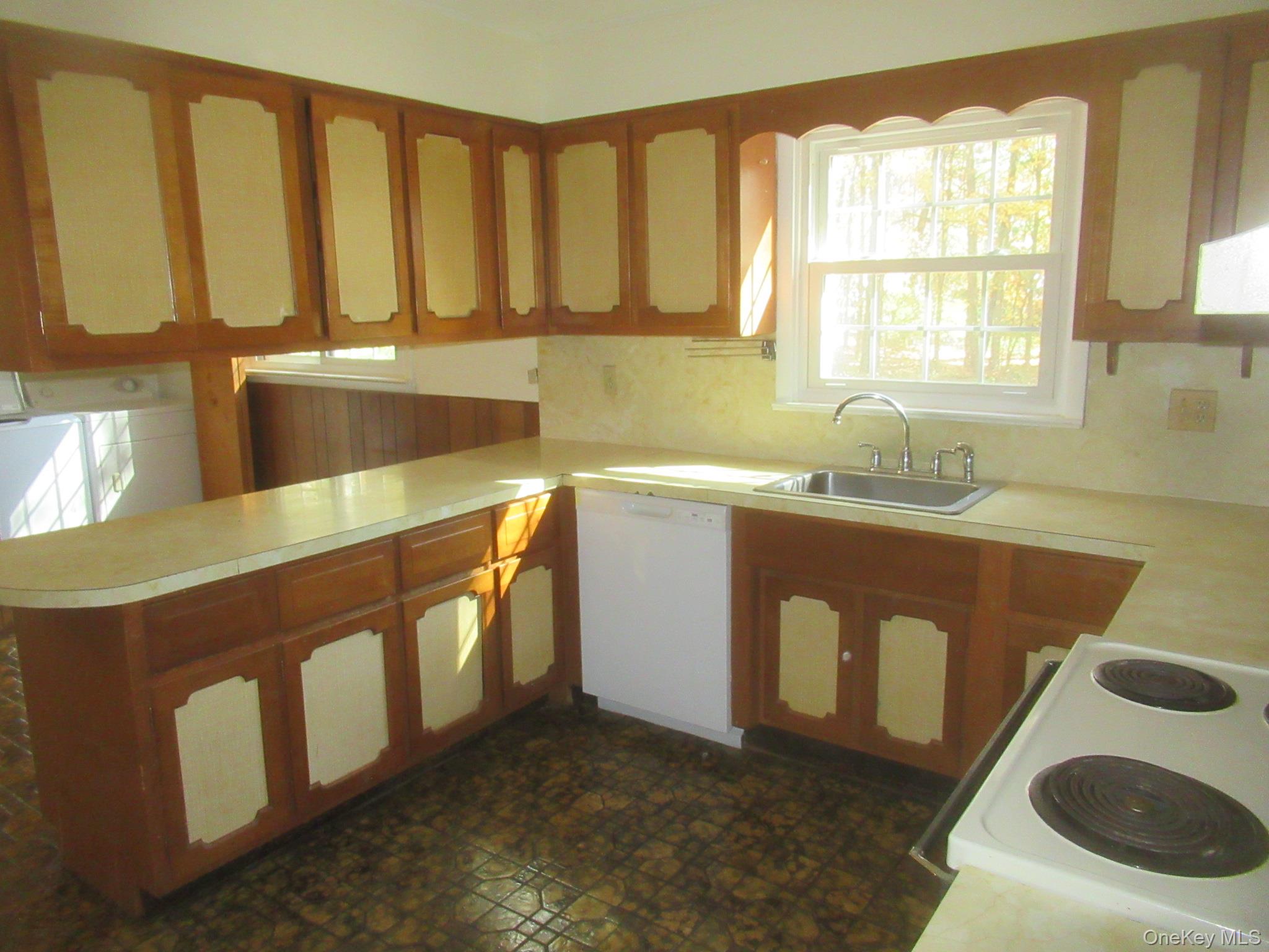 77 Brothers Road Wappingers Falls, NY 12590 - Photo 19 of 21 a utility room with stainless steel appliances granite countertop a sink a stove and a window