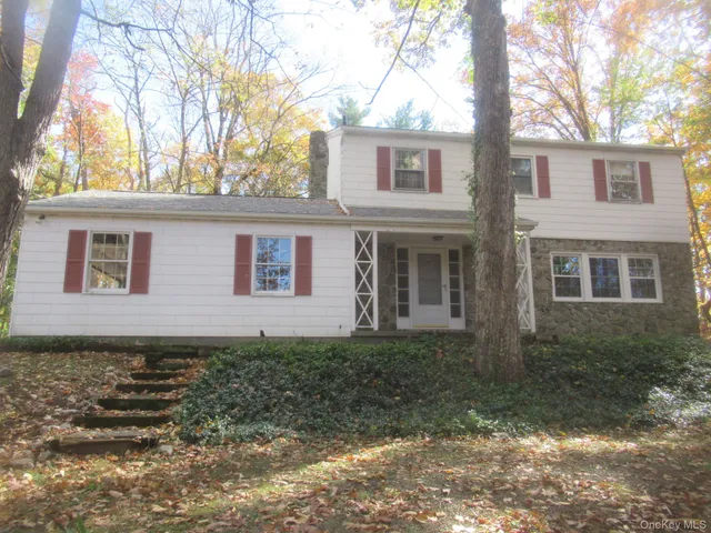 a view of outdoor space with deck and trees