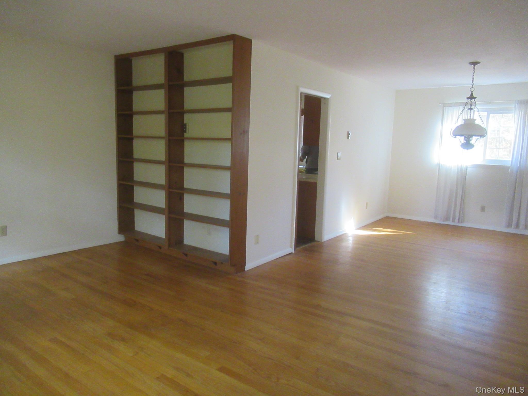 77 Brothers Road Wappingers Falls, NY 12590 - Photo 8 of 21 a view of empty room with wooden floor and fan