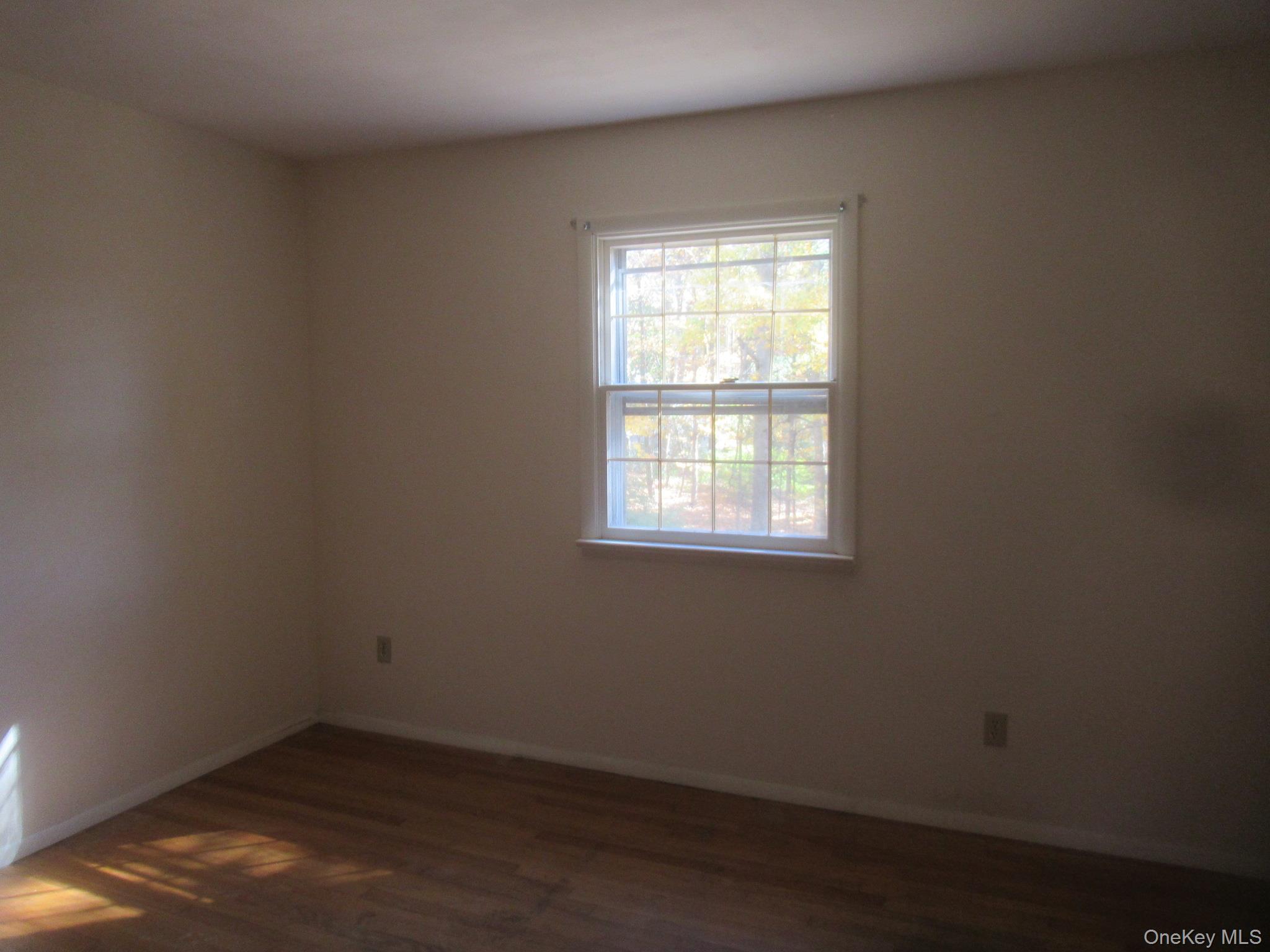 77 Brothers Road Wappingers Falls, NY 12590 - Photo 10 of 21 an empty room with a window