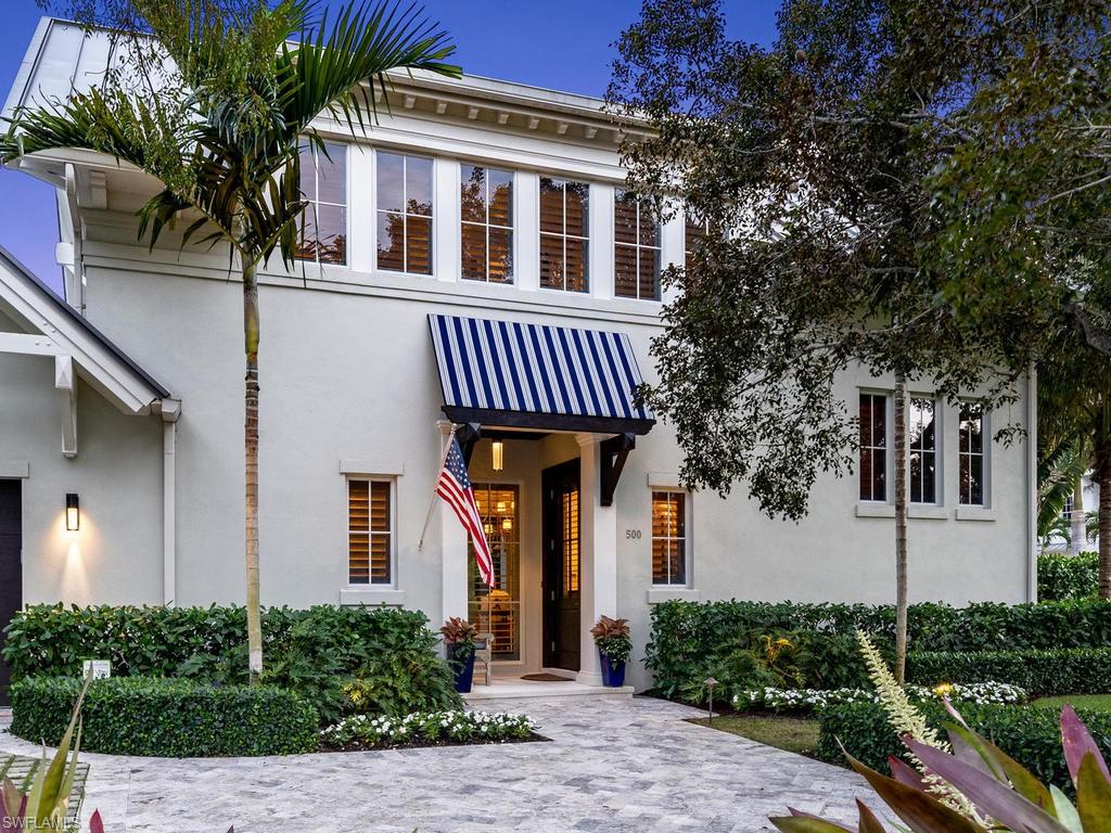 500 3rd Avenue North Naples, FL 34102 - Photo 1 of 21 a front view of a house with garden