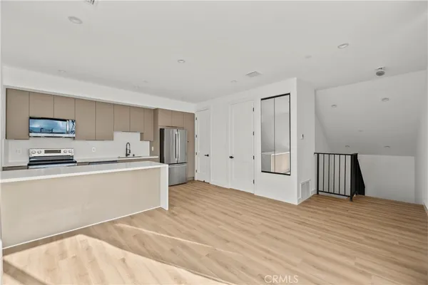 a view of kitchen with wooden floor