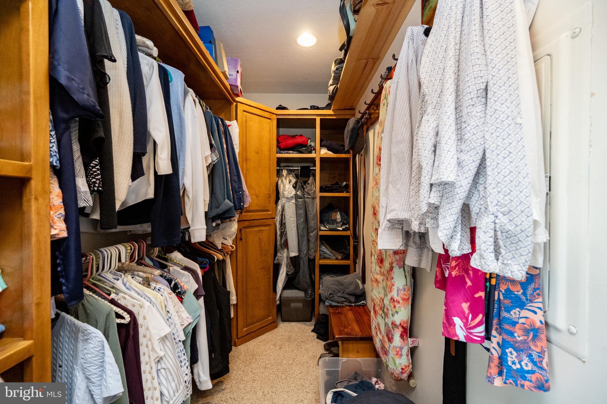 328 Stool Rock Road Oakland, MD 21550 - Photo 54 of 133 a view of walk in closet with clothes and shoes