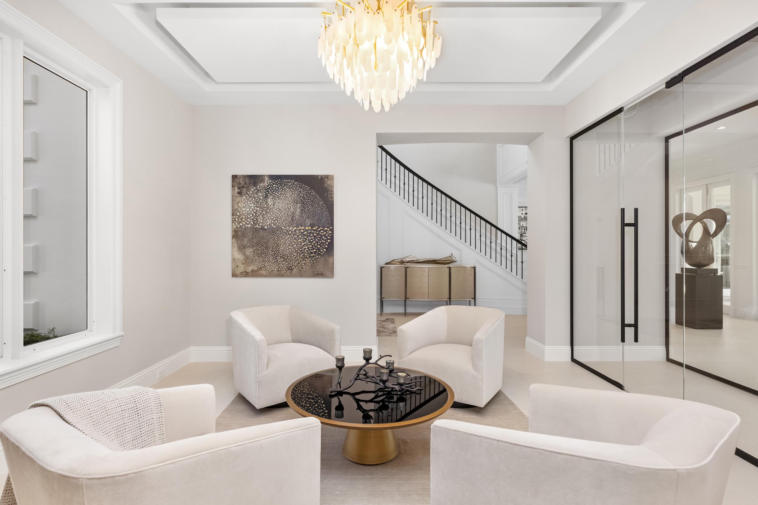 2989 Spanish River Road Boca Raton, FL 33432 - Photo 13 of 130 a living room with furniture and a chandelier