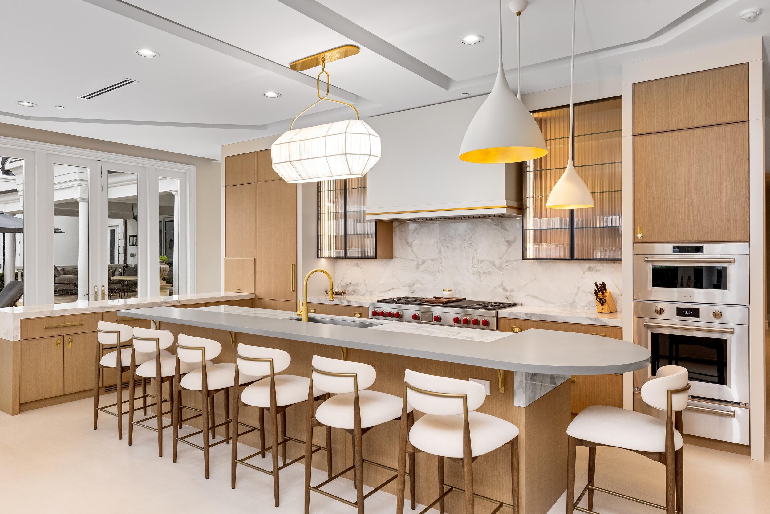 2989 Spanish River Road Boca Raton, FL 33432 - Photo 16 of 130 a kitchen with a table and chairs in it