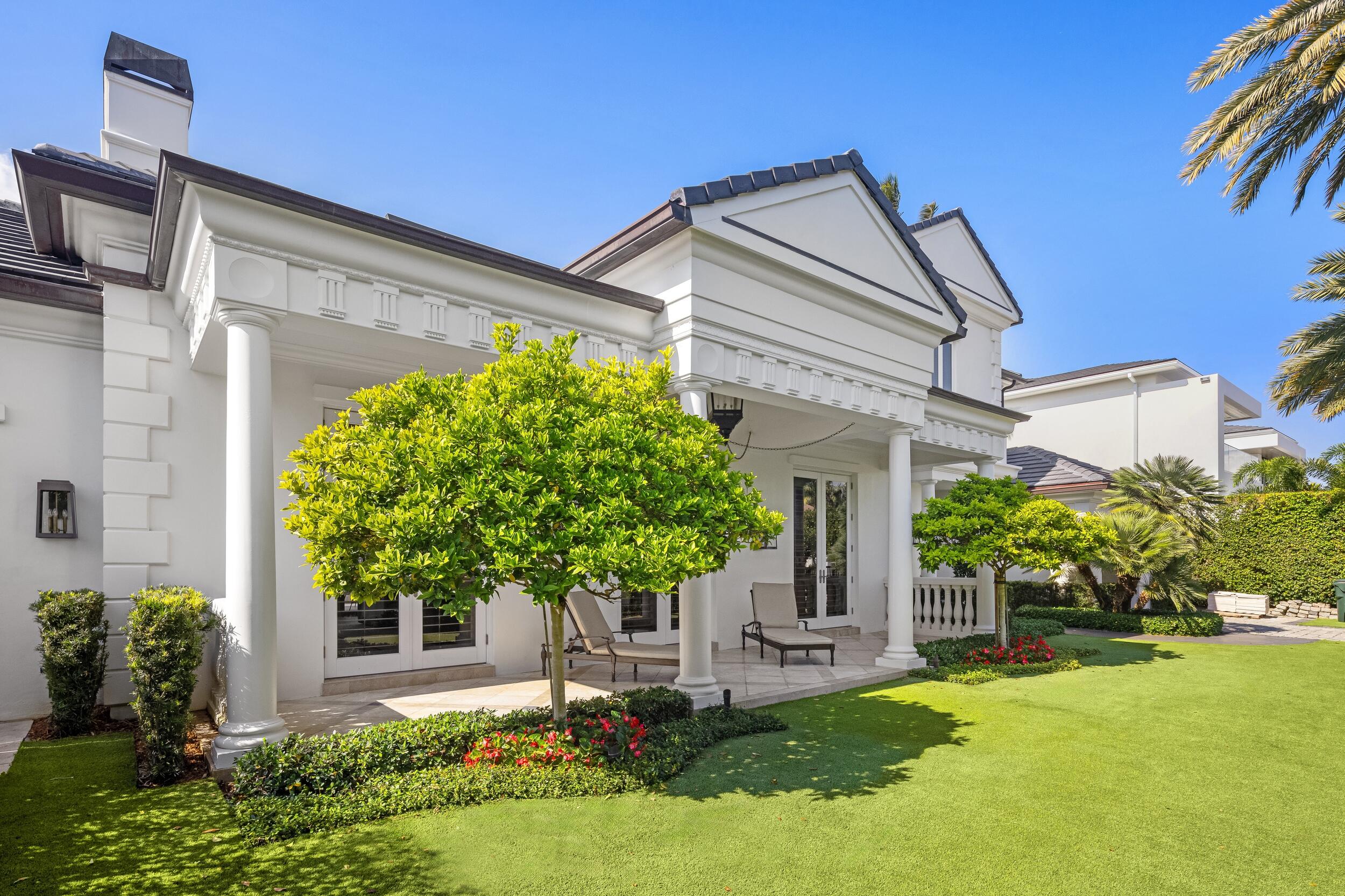 2989 Spanish River Road Boca Raton, FL 33432 - Photo 28 of 130 a front view of a house with garden