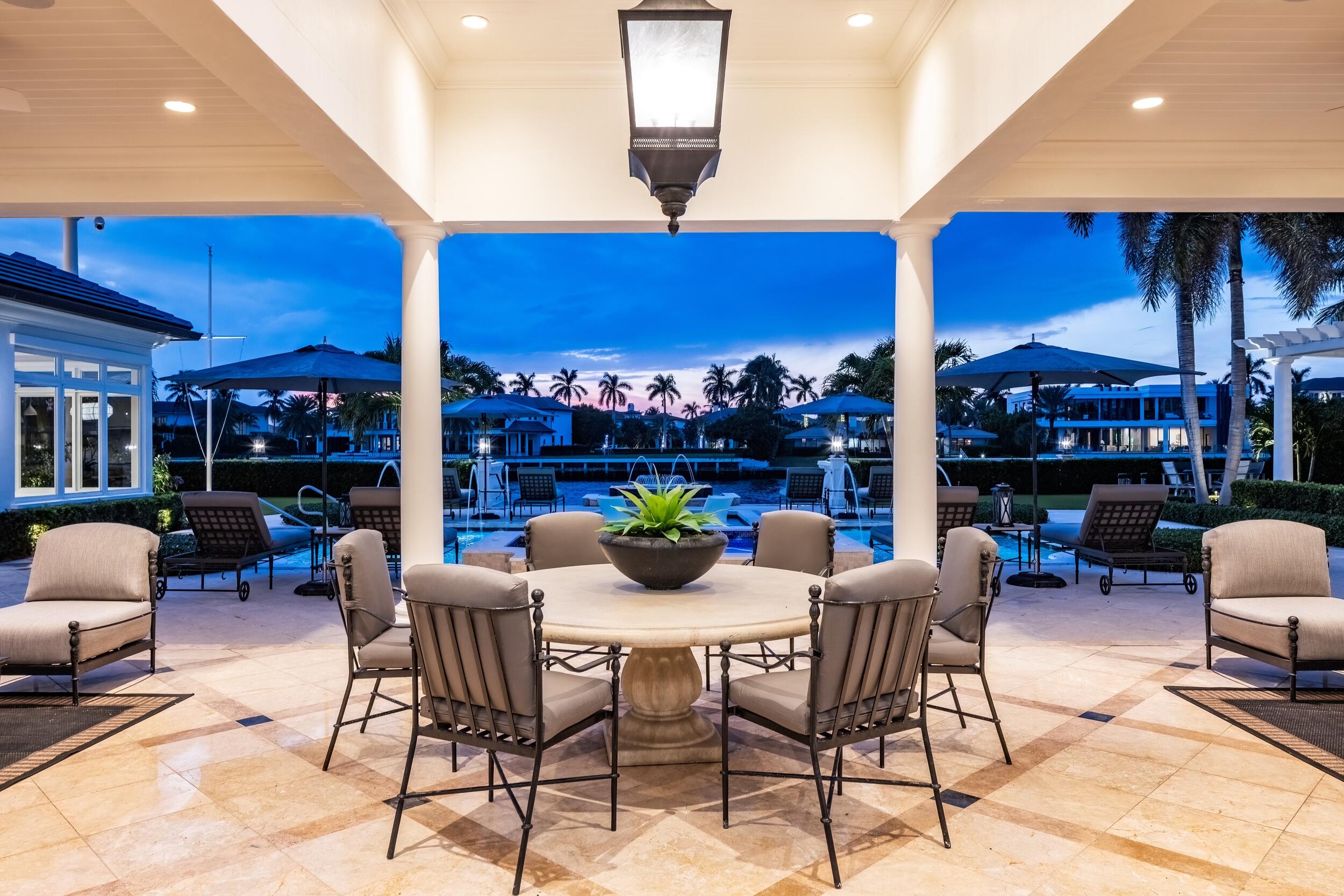 2989 Spanish River Road Boca Raton, FL 33432 - Photo 37 of 130 a view of a dining tables and chairs in the patio