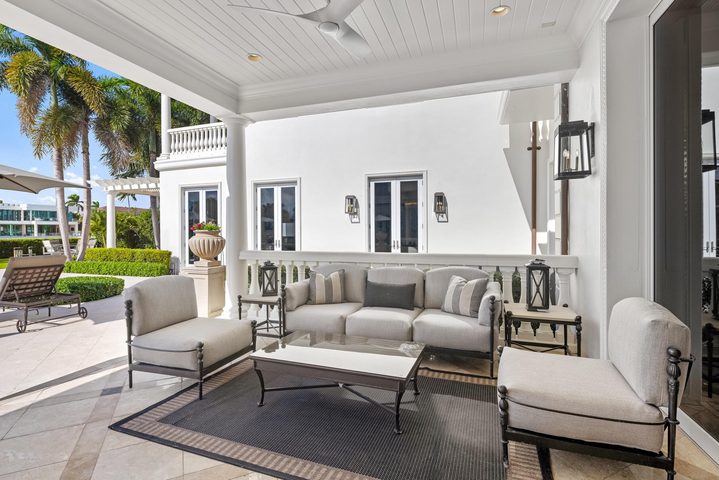 2989 Spanish River Road Boca Raton, FL 33432 - Photo 39 of 130 a living room with furniture fireplace and a large window