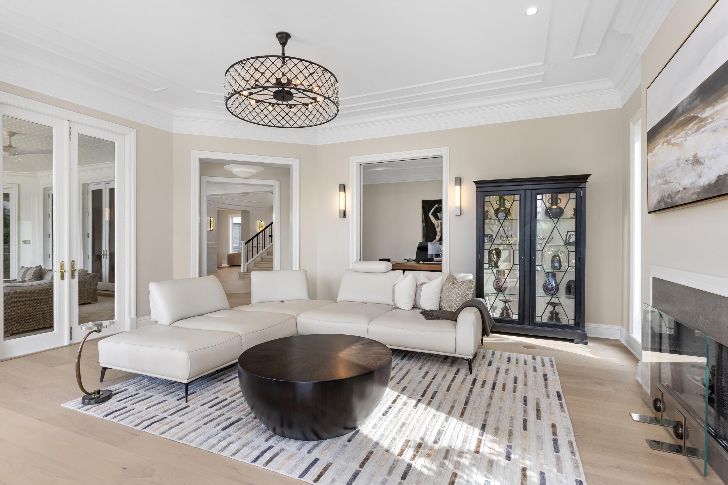 2989 Spanish River Road Boca Raton, FL 33432 - Photo 63 of 130 a living room with furniture a large window and a chandelier