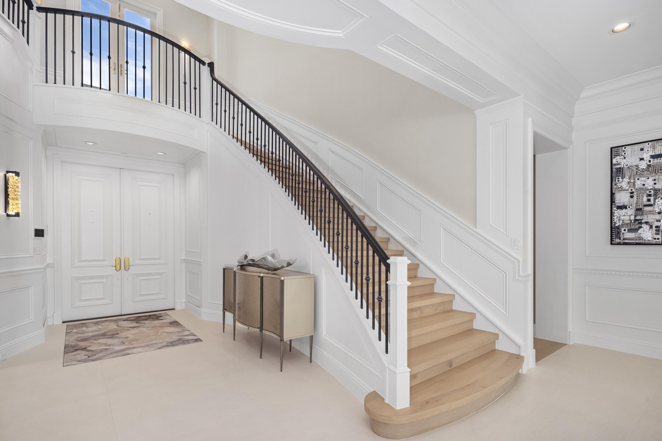 2989 Spanish River Road Boca Raton, FL 33432 - Photo 8 of 130 a view of staircase with white walls and stairs