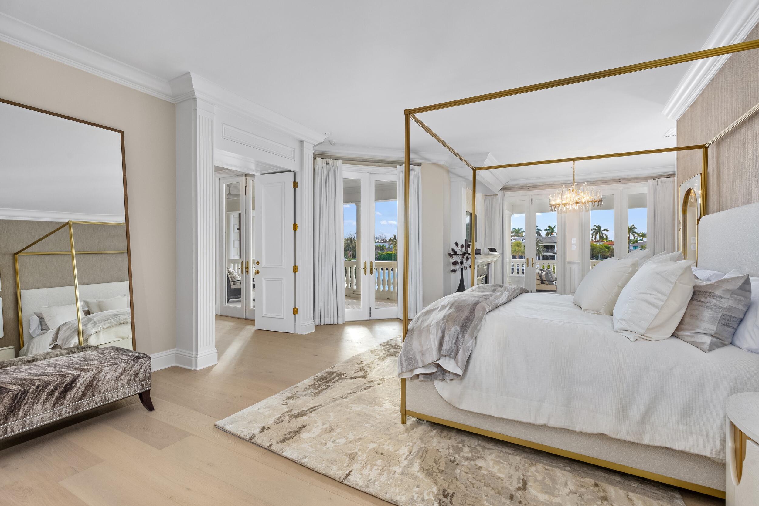 2989 Spanish River Road Boca Raton, FL 33432 - Photo 81 of 130 a spacious bedroom with a bed and glass walk in closet