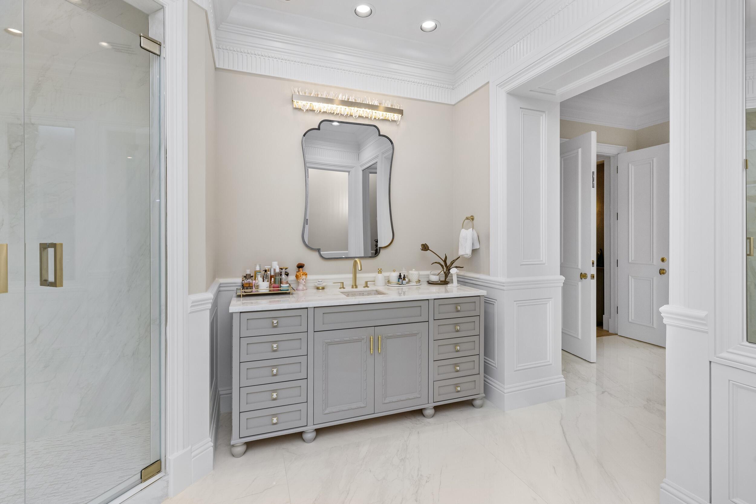 2989 Spanish River Road Boca Raton, FL 33432 - Photo 85 of 130 a bathroom with a double vanity sink and a mirror