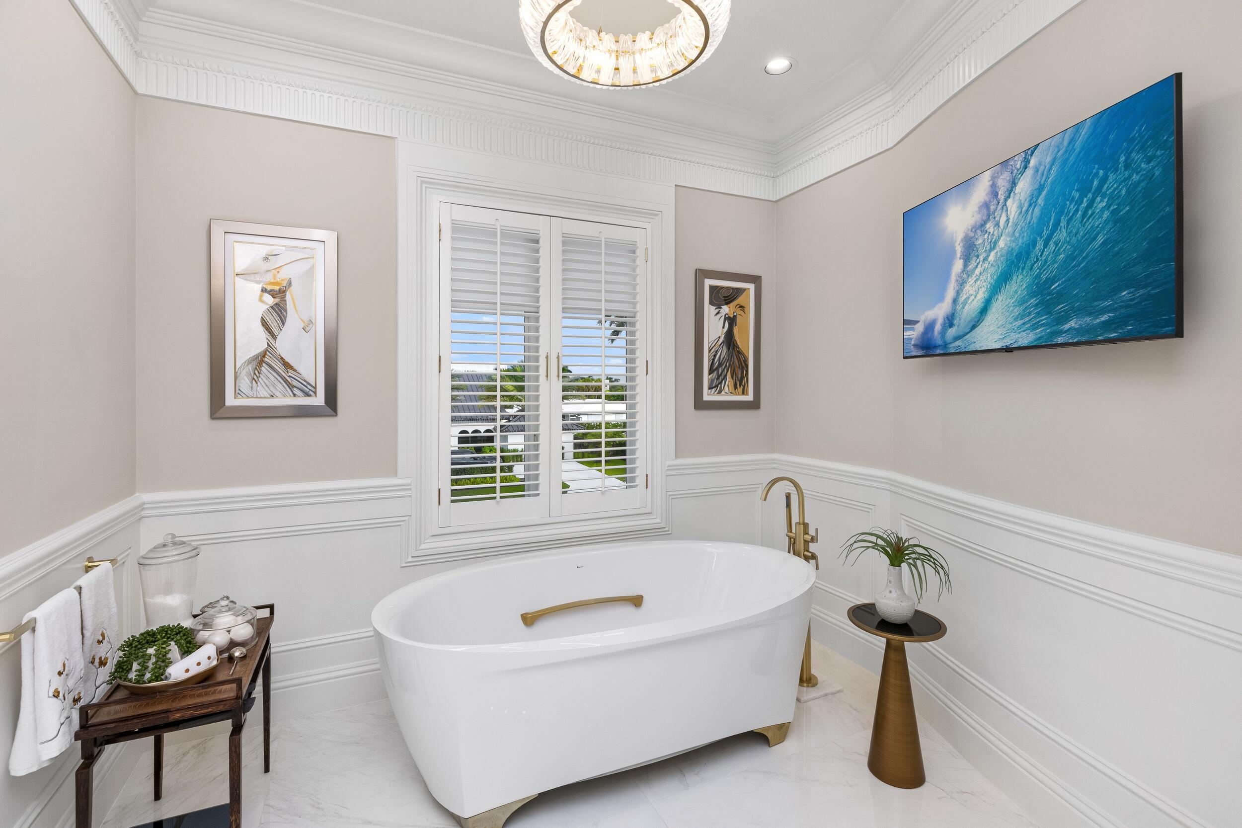 2989 Spanish River Road Boca Raton, FL 33432 - Photo 86 of 130 a white bath tub sitting next to a window