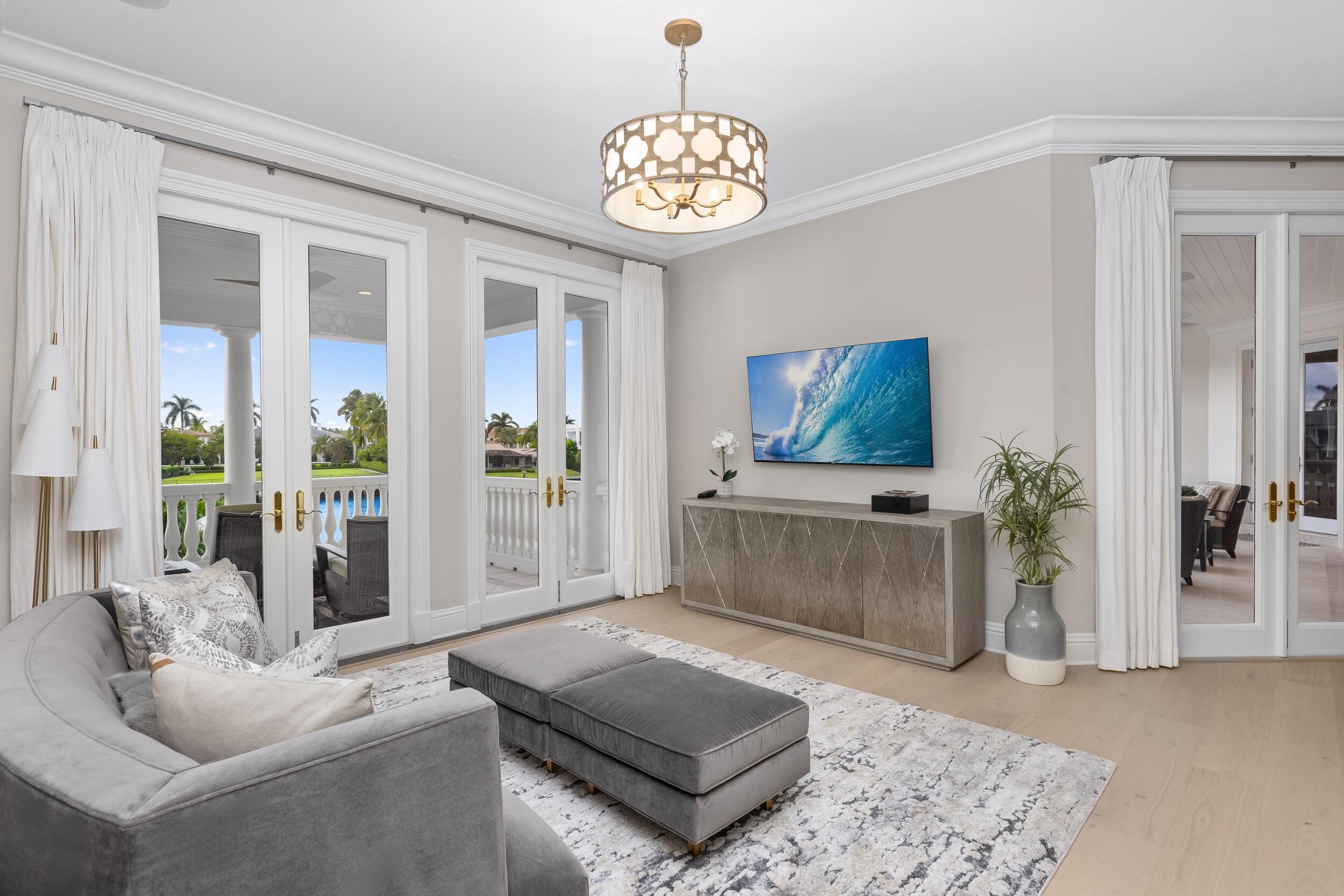 2989 Spanish River Road Boca Raton, FL 33432 - Photo 93 of 130 a living room with furniture and a flat screen tv