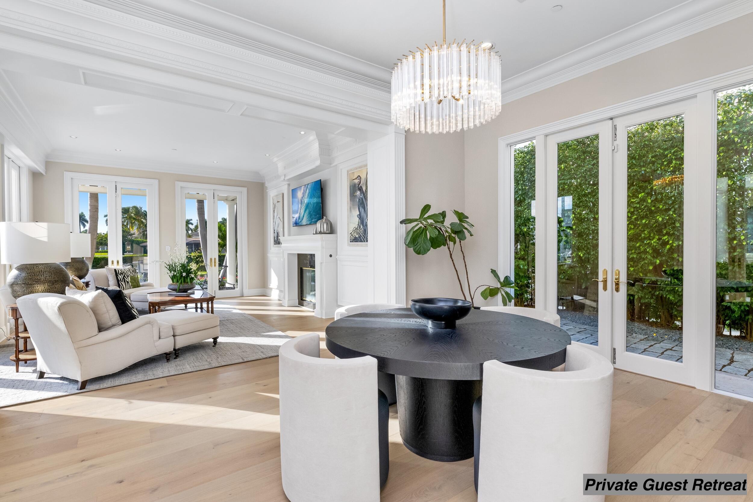 2989 Spanish River Road Boca Raton, FL 33432 - Photo 100 of 130 a living room with fireplace furniture and a chandelier