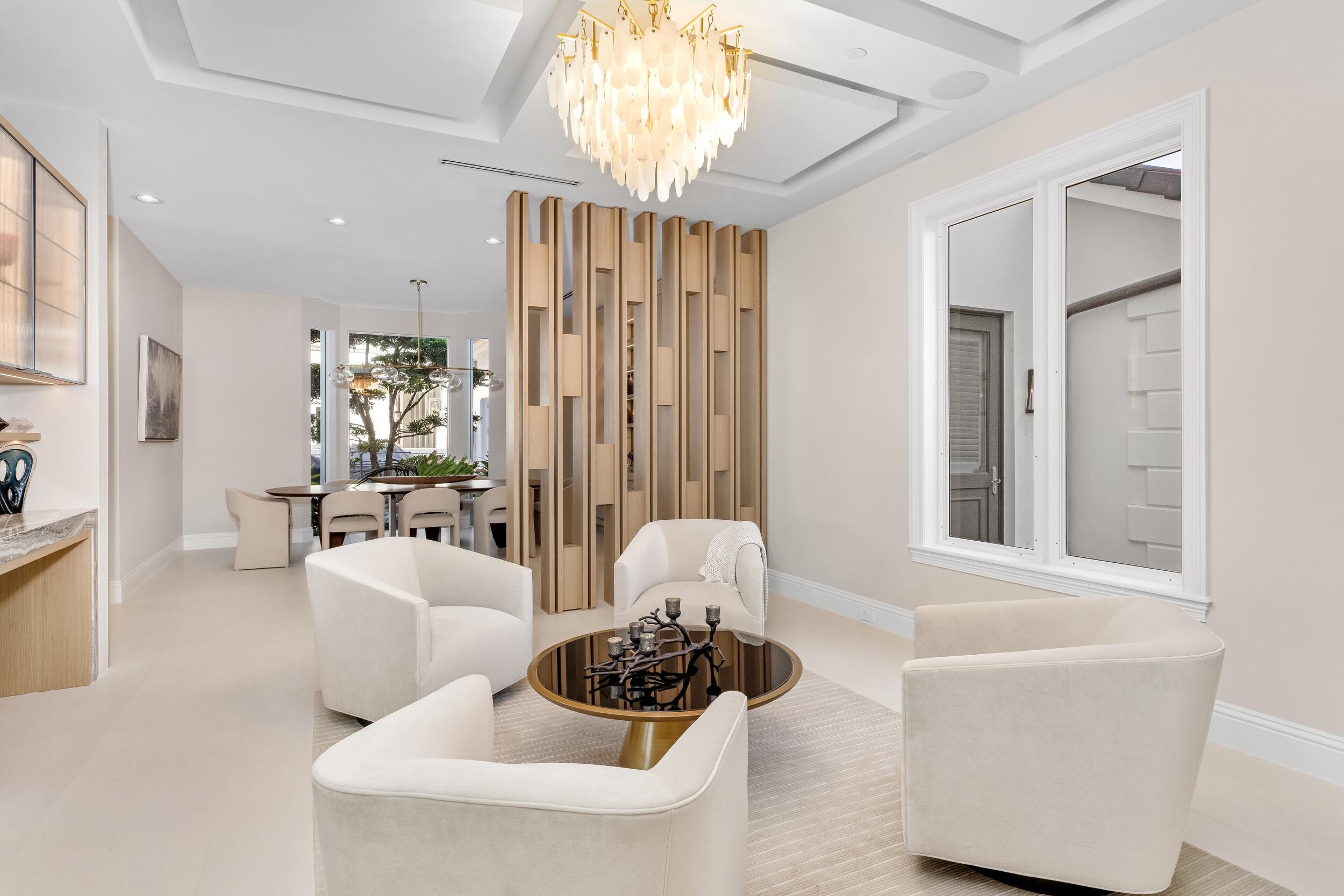 2989 Spanish River Road Boca Raton, FL 33432 - Photo 10 of 130 a living room with furniture and a chandelier