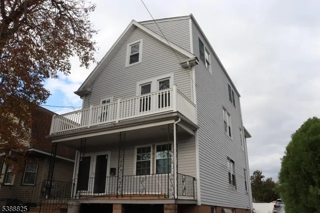a front view of a house with a balcony