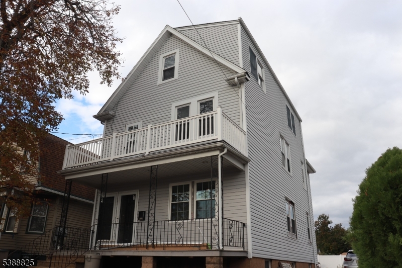 66 Winant Avenue Ridgefield Park, NJ 07660 - Photo 16 of 16 a front view of a house with a balcony