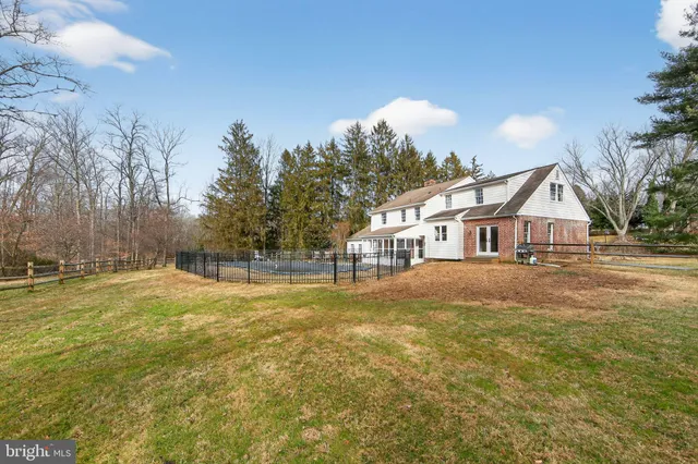 a view of big yard and large trees