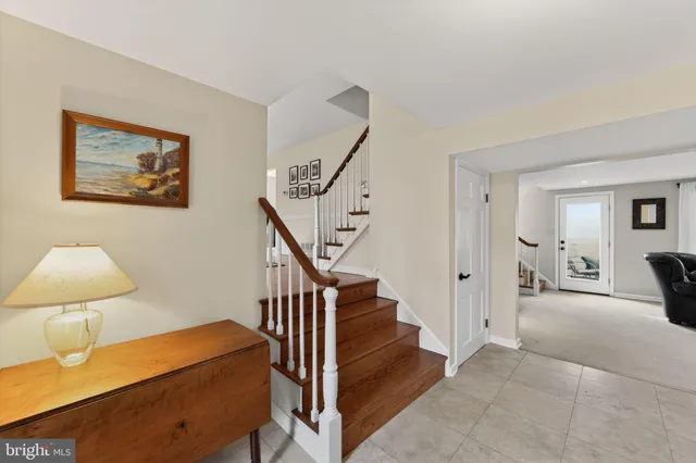 a view of a hallway with windows and workspace