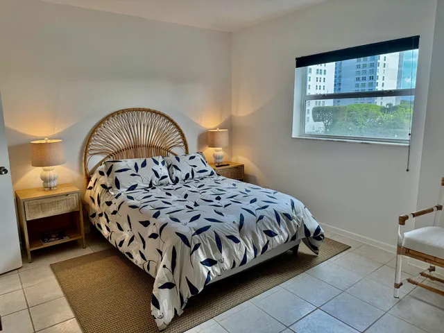 a bedroom with a bed and a walk in closet