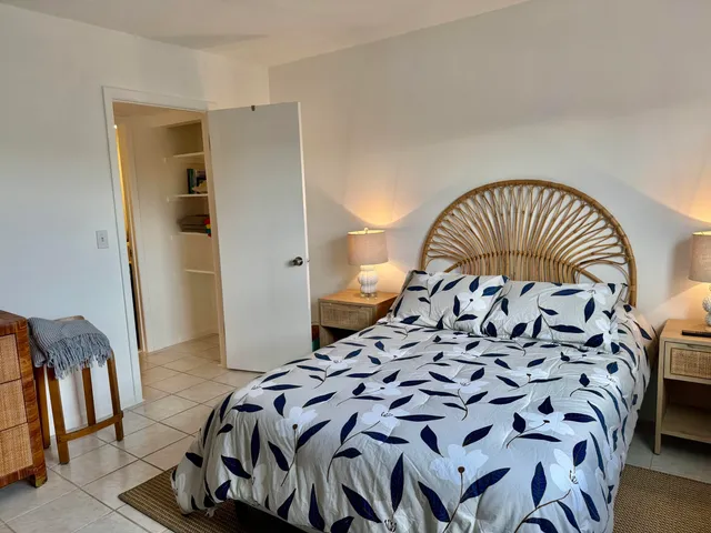 a bedroom with furniture and a flat screen tv