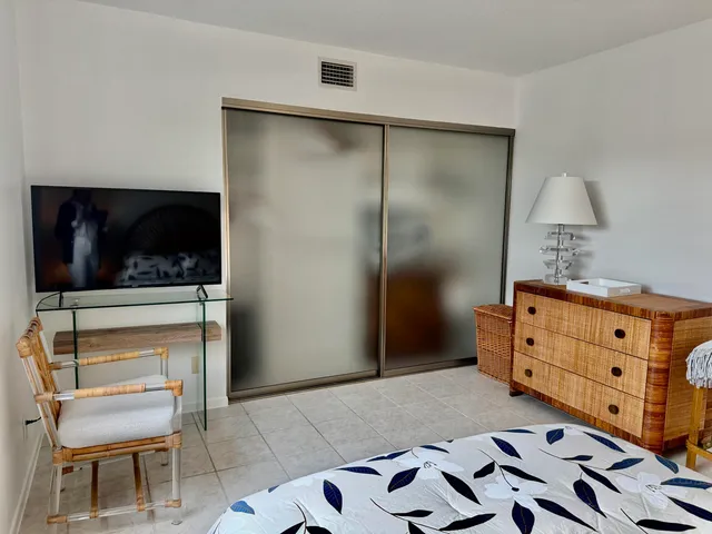a bathroom with a double vanity sink toilet and a mirror