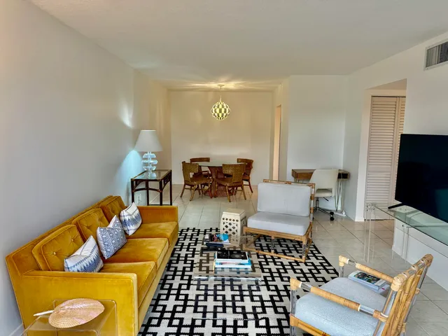 a kitchen with stainless steel appliances a sink a stove and a refrigerator