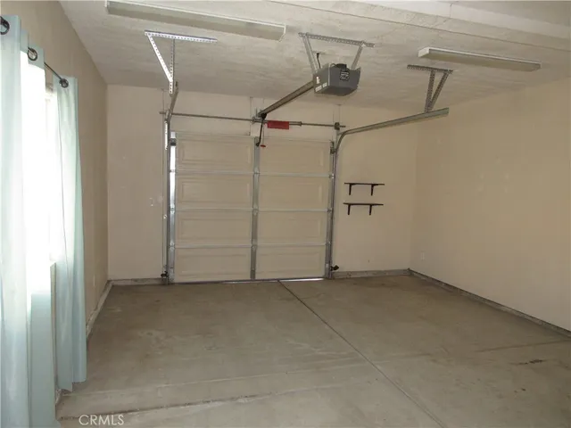 an aerial view of a house with a swimming pool
