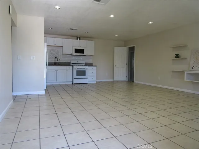 an empty room with a bathroom